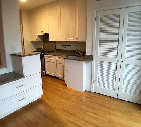 Kitchen and storage closet from sunroom