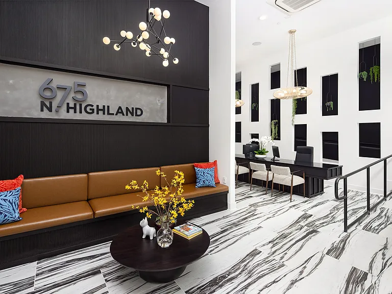 Welcoming Lobby Featuring Lounge Bench, Statement Lighting, and Sleek Reception Area at 675 N. Highland