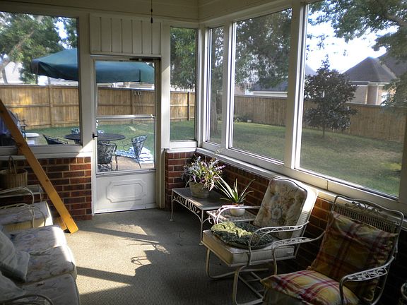 Screened Sunroom overlooking the backyard