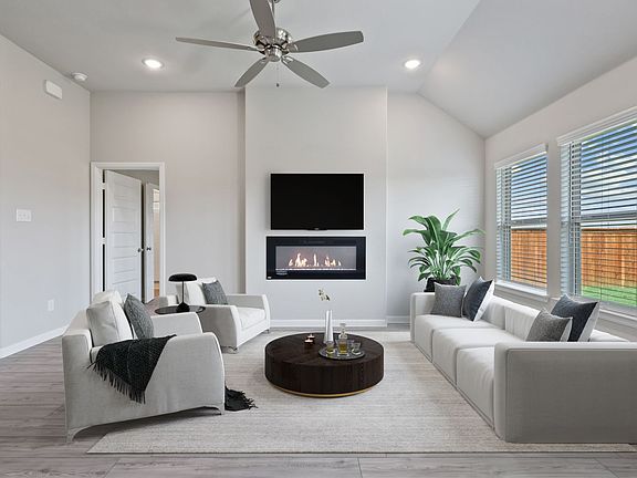 Living room in the Amethyst home plan by Trophy Signature Homes - REPRESENTATIVE PHOTO