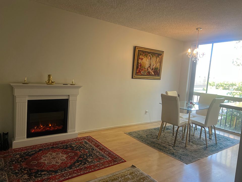 Living room, big beautiful window with electric fire place