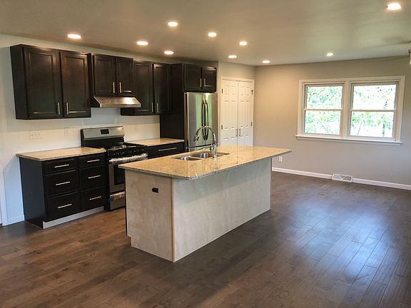 Open kitchen with hardwood 
