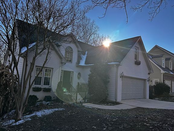 Front view with two car garage