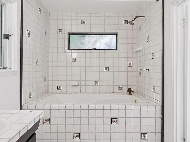 Large tile, soak tub and shower.