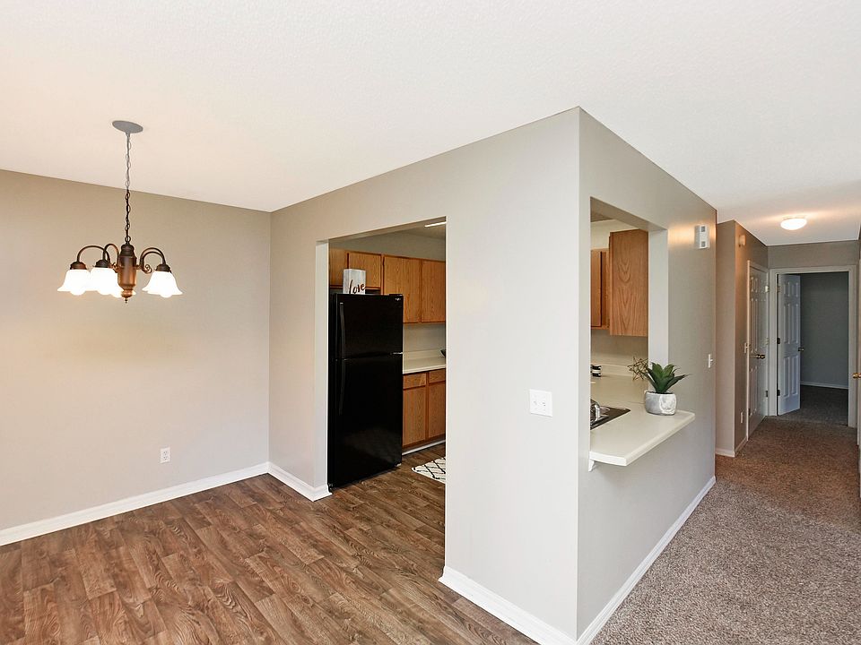 Explore this chic apartment interior, boasting a blend of contemporary kitchen design and inviting dining space.