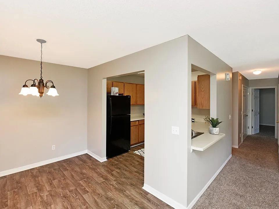 Explore this chic apartment interior, boasting a blend of contemporary kitchen design and inviting dining space.