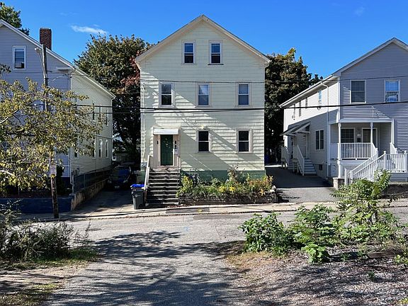 Front Parking Lot & House across the Street