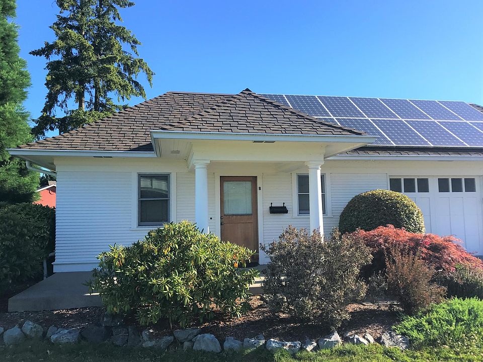 Landscaped entryway, fully maintained by owner.