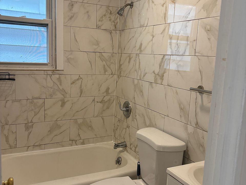 Beautiful light-tiled bathroom