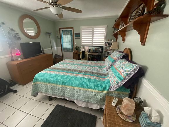 master bedroom with door to back deck