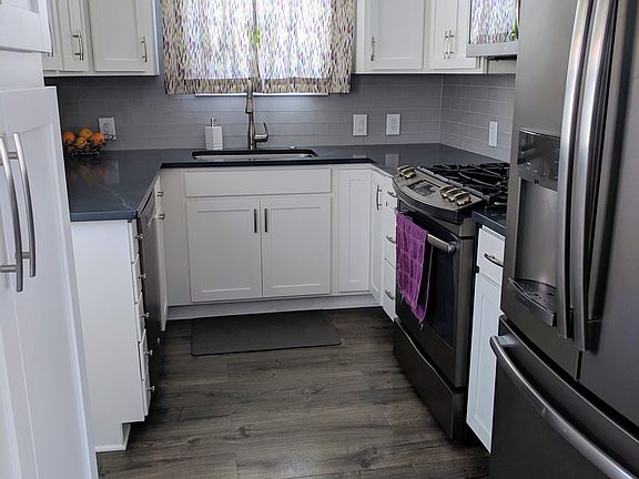 Galley kitchen, lots of storage. Quartz countertops. Gas stove.