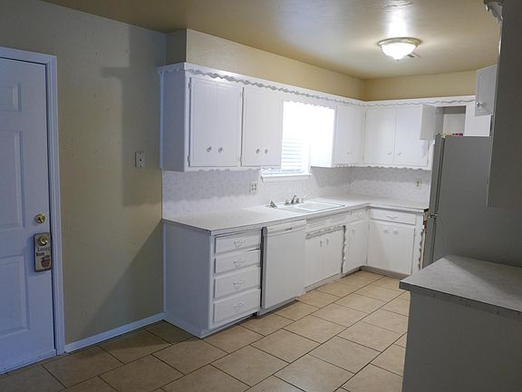 Kitchen with ceramic tile and newly painted.