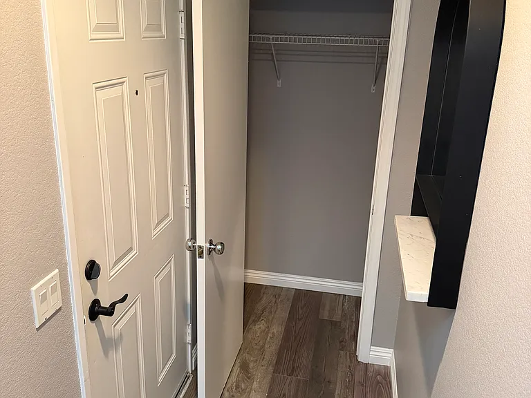 Spacious entryway closet for shoes, coats, and everyday storage.