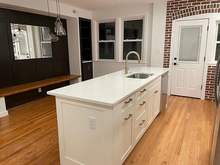 Island with built in trash cans on pull out.