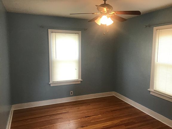 Bedroom with ceiling fan.