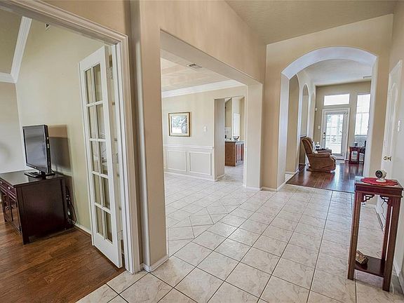 Beautiful details accent the floors and walls of the dining room