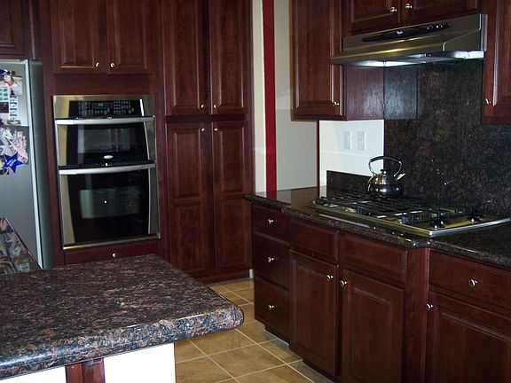 Granite Counter Tops, Cherry Cabinets, Stainless Steel Appliances