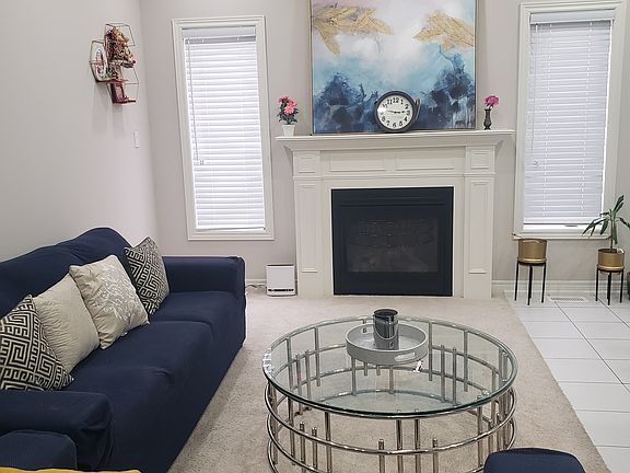 Open concept large living room with gas fireplace