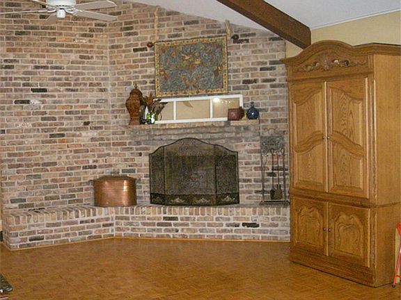 Fireplace opposite end of window seat wall