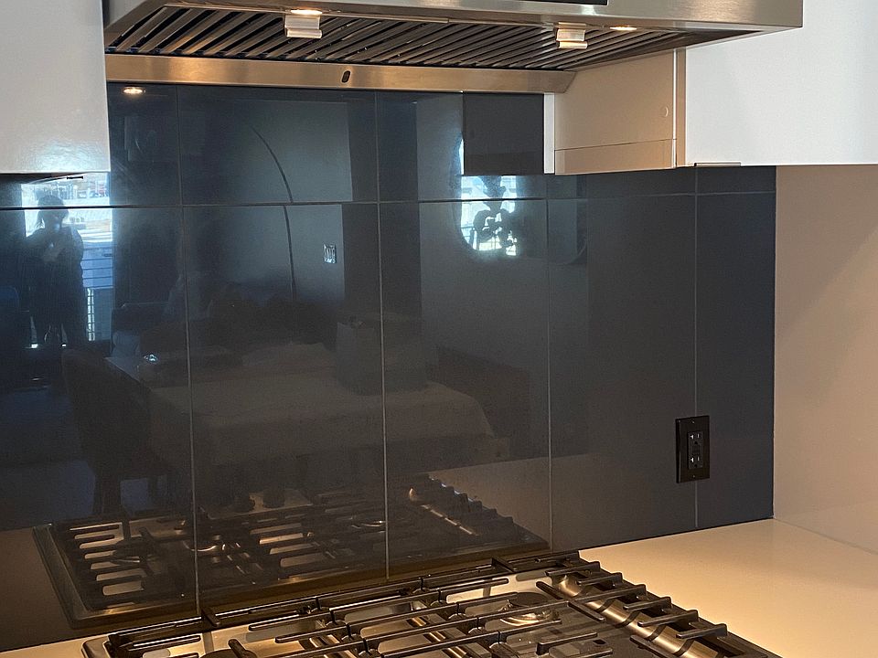 Detail shot of the stove, oven, and range hood.