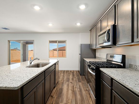 The kitchen opens up to the back patio.