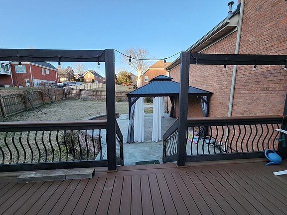 Big backyard with fence and covered patio