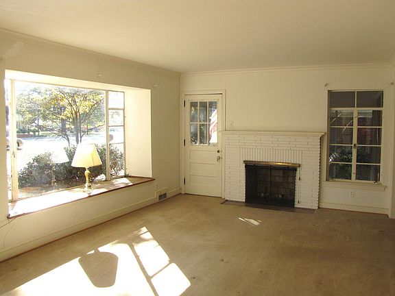 Spacious Living rm with fireplace and large Bay Window