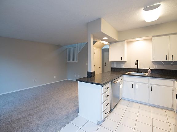 Brand new kitchen granite countertop, appliances, sink, faucets, paint and carpet.