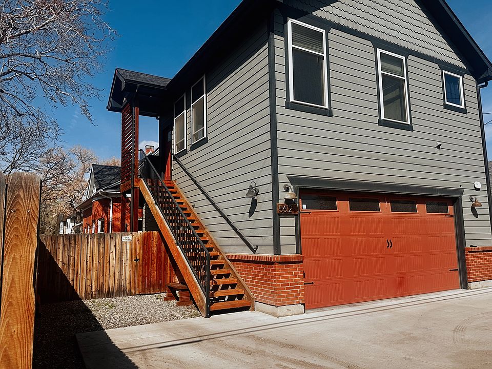 Entry to upstairs unit. Parking space left of stairs.