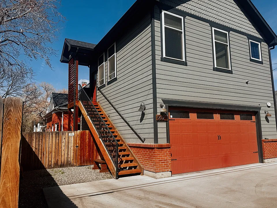 Entry to upstairs unit. Parking space left of stairs.