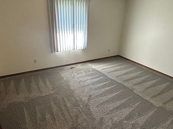 Bedroom #1. Carpets have been professionally cleaned.