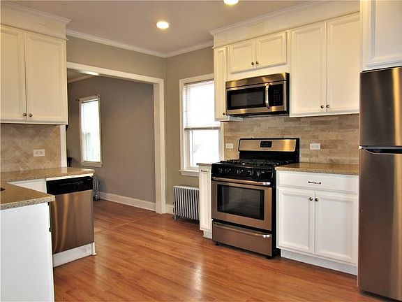 Nice Bright Open Floor Plan, Modern Kitchen Cabinets with Hard Surface Counters & SS Appliances!