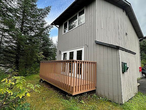 Back deck and oil tank shed.