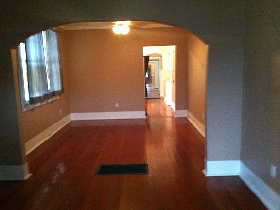 Large double parlor in front for living/ dining areas. Kitchen is 3rd room. Bath and bedroom in the back. Last room is furnished Laundry area.