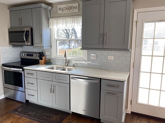 New Kitchen: 19 ft x 15 ft - New Cabinets, quartz counter tops, appliances, floors, backsplash and lighting.