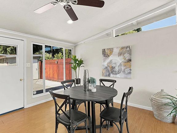 opens to the dining area, overlooking the backyard..