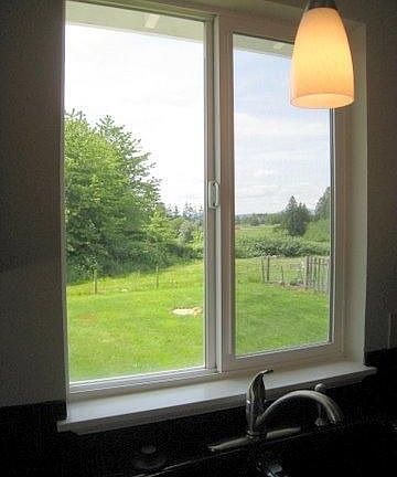 The view from the kitchen seems endless and it overlooks the huge backyard.