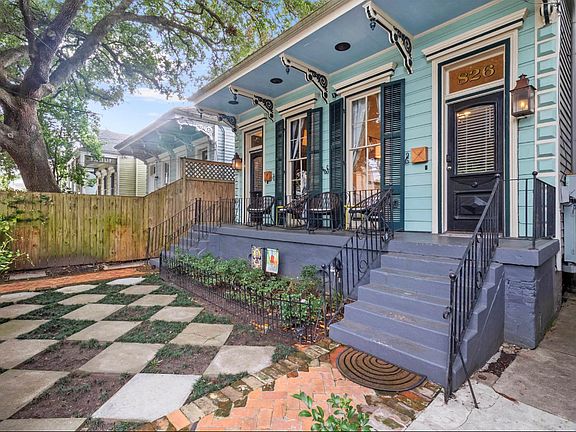 The house is a duplex and the front yard is a shared space