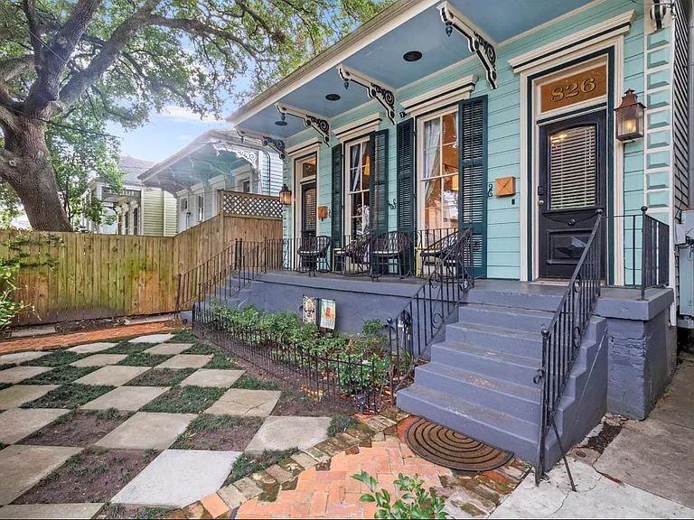 The house is a duplex and the front yard is a shared space
