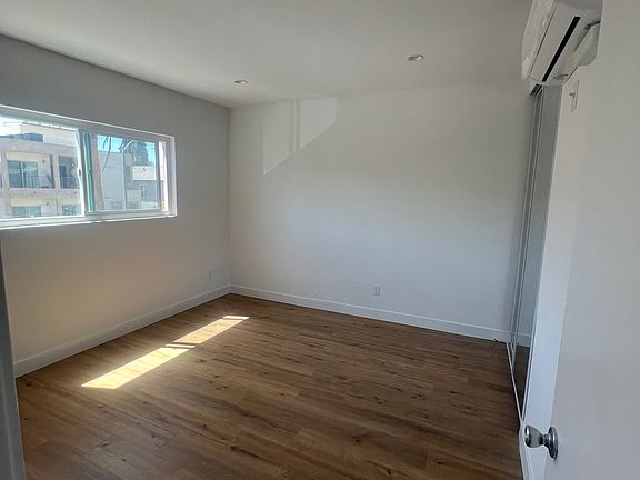 Bedroom with plenty of light and storage in closet. Brand new A/C in each bedroom and living area