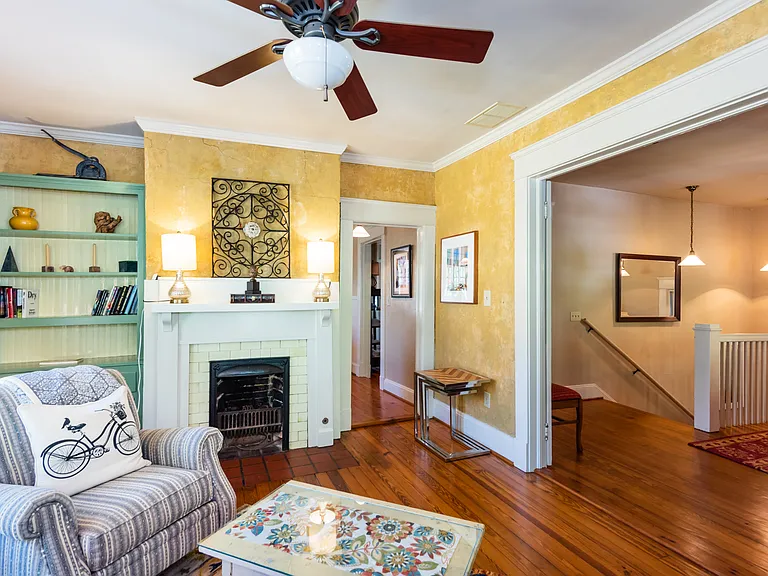 Living room
+TV
+Fireplace (non-functional)
+Large sofa
+Large windows
