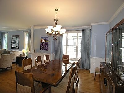 Dining Room w/crown molding, HWFs , columns & chandelier