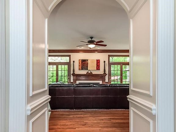 transitional arched hallway with stunning millwork