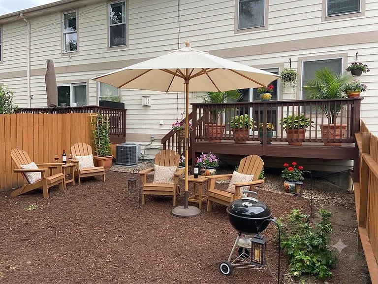 Private, fenced backyard. (Furnishings for illustrative purposes only, not included.)