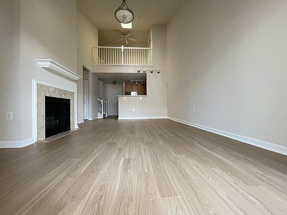 Two-level top floor unit with a skylight loft on the upper floor.