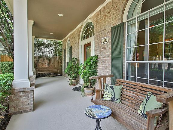 Tranquil Covered Front Porch with Swing.