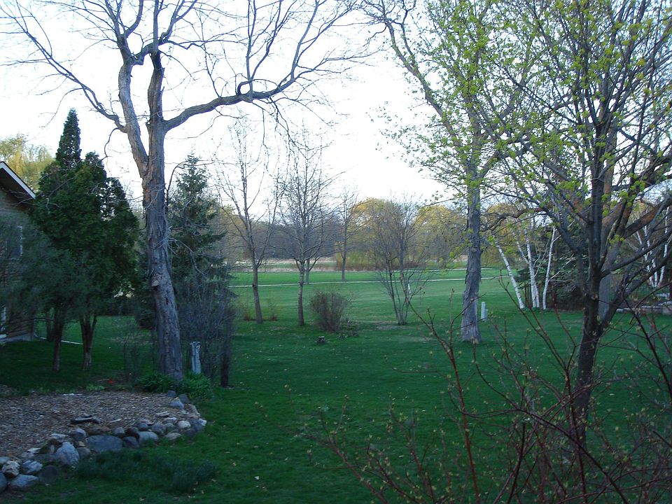 Backyard looking off the deck at golf course