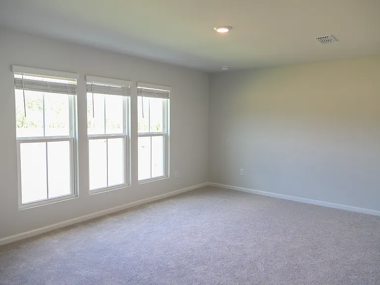 Master bedroom with 3 large windows