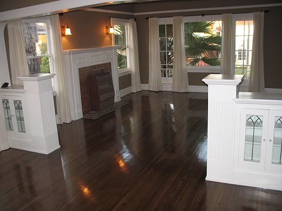 Living room with lots of windows and architectural deals.