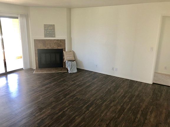 Living room with wood burning fireplace